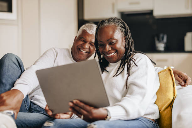 istock Happy senior couple having a video call at home 1406906066