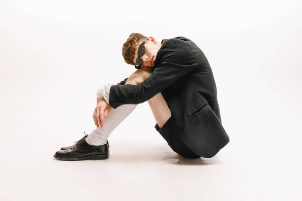 istock One young stylish man, student in black shorts and jacket posing isolated over white background. Concept of fashion, youth, emotions, studying, ad 1406906640