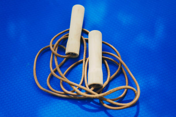 istock Jump rope on blue yoga mat 1406906718
