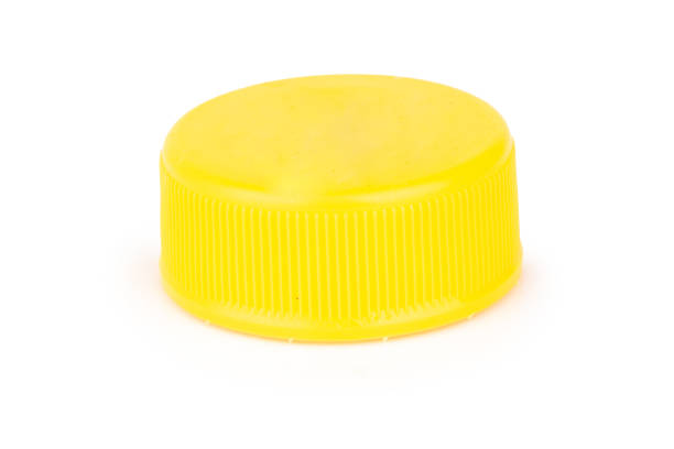 istock bottle cap plastic yellow isolated on white background 1406909742