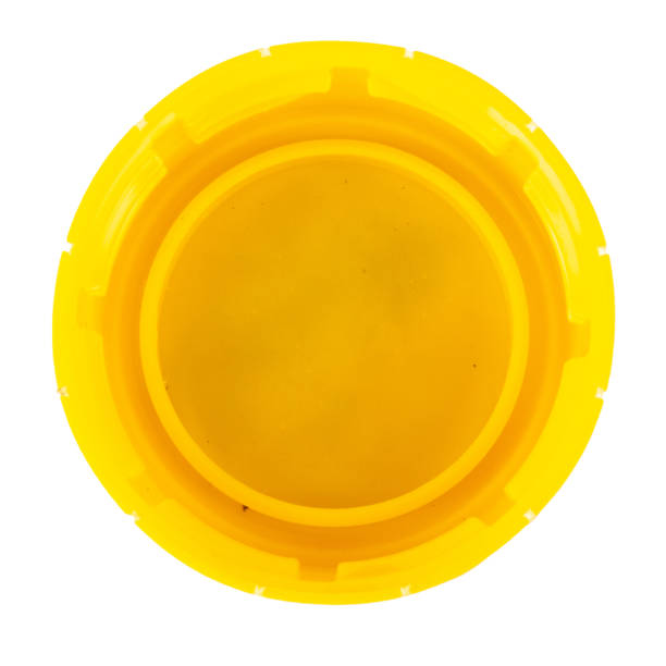 istock bottle cap plastic yellow isolated on white background 1406909746
