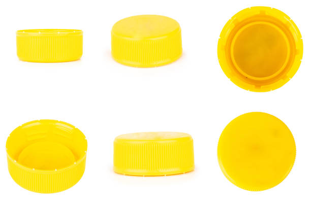 istock bottle cap plastic yellow isolated on white background 1406909759