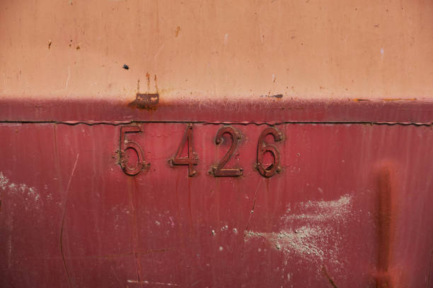 istock Rusty metal surface of red colour numbers on a background Old metal container 1406909824