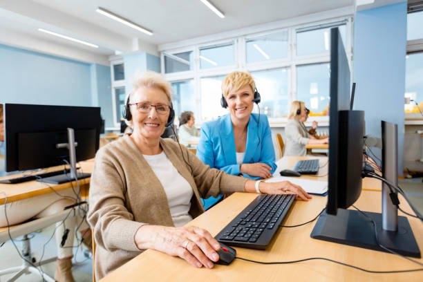 istock Smiling female employees at desk 1406911142