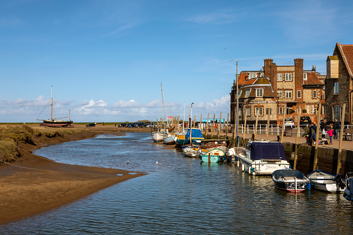 Norfolk, UK - April 8th 2022: View of the harbour in the village of Blakeney, North Norfolk, UK.