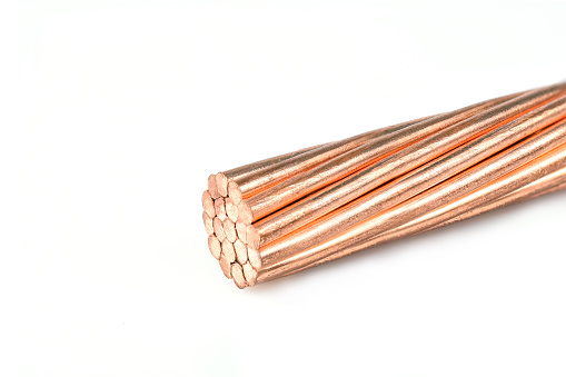 Electrical power cable on white background. Copper wire is the electric conductor of urban society.