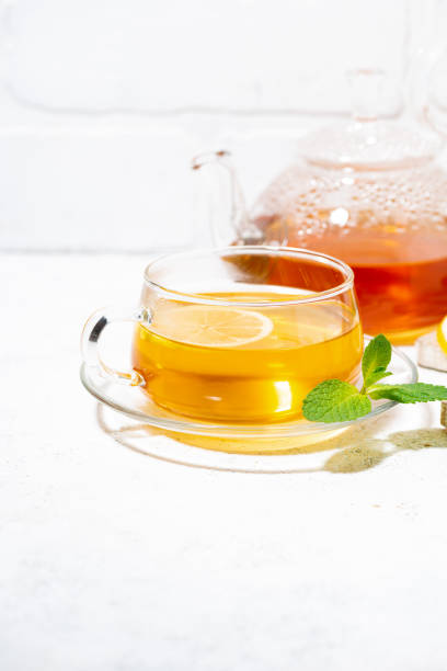 istock healthy tea for immunity with ginger, lemon and mint, vertical closeup 1406914846