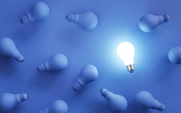 Glowing lamp among shutdown blue lightbulb for smart thinking and creative problem solving concept by 3d render illustration.