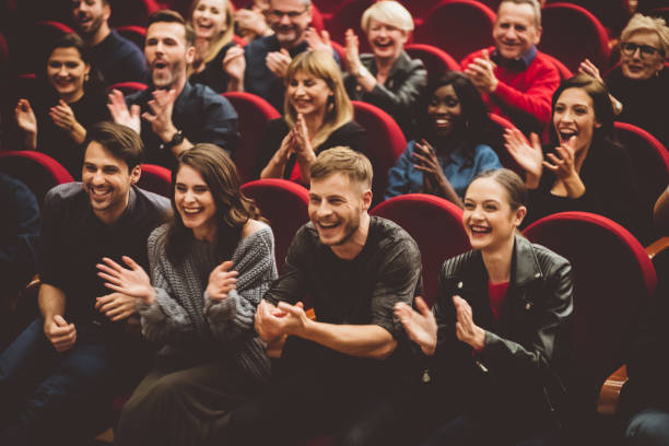 istock Happy audience applauding in the theater 1406917128