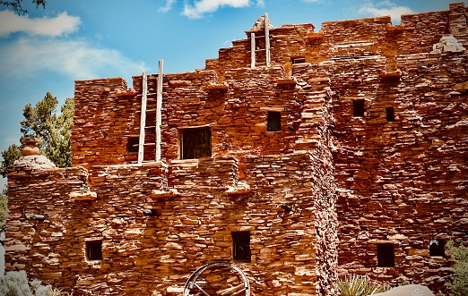 A beautiful red stone building used to house the Hopi tribe in the Southwestern desert