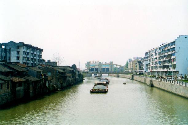 istock Ancient canal town Chengguan in 2000,  cargo ship on the canal 1406917416