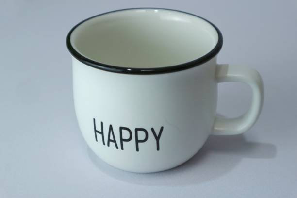istock White ceramic cup with happy text in the center 1406917625