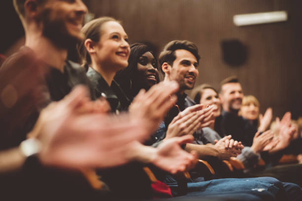 istock Happy people applauding in the theater 1406917661