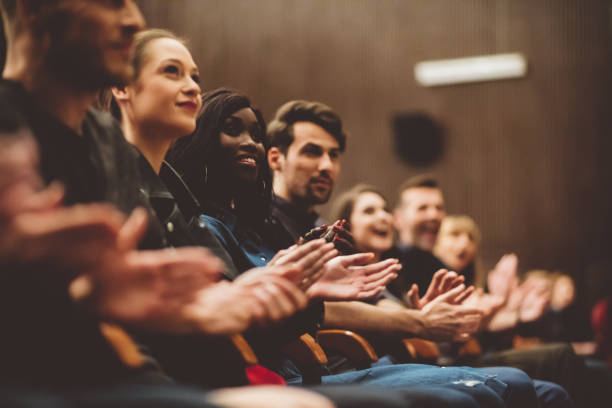 istock Happy people applauding in the theater 1406918533