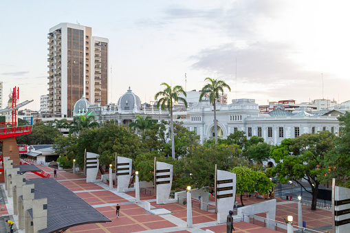 Guayaquil, Guayas Province, Ecuador - Junes 10, 2022: Part of Malecon 2000 in Guayaquil's Downtown, Guayas Province, Ecuador, South America in a colorful afternoon.\n\nGuayaquil is a port city in Ecuador, known as a gateway to Pacific beaches and the Galapagos Islands. Stretching along the Guayas River is the waterfront Simón Bolívar promenade, home to La Rotonda monument. In the north, Las Peñas is a neighborhood full of colorful houses. Stairs lined with cafes and art galleries lead up Santa Ana Hill, site of Santa Ana chapel, a lighthouse and views of the city.