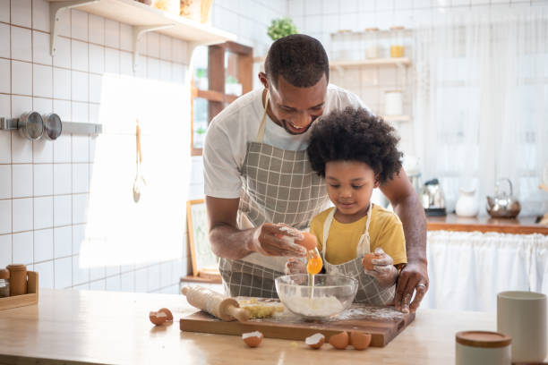 istock Black African American Father and son baking 1406922278
