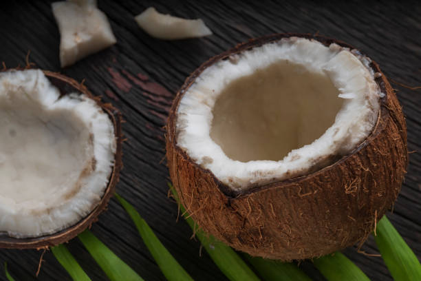 istock Chopped coconut on a wooden background 1406922600