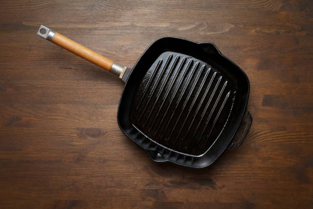 istock Empty grill pan for frying bbq on wooden table 1406922745