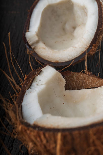 istock Chopped coconut on a wooden background 1406922751