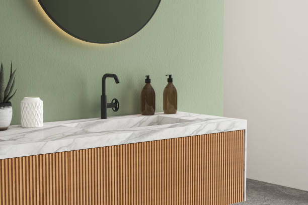istock Comfortable white marble basin with oval mirrors are standing on wooden countertop 1406922916