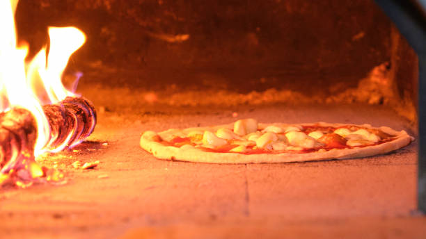 istock wood-fired oven for a pizza party 1406924584