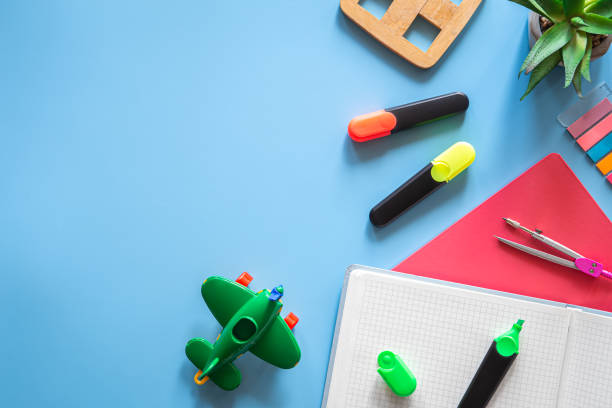 istock School supplies stationery on a blue background, copy space. 1406926828