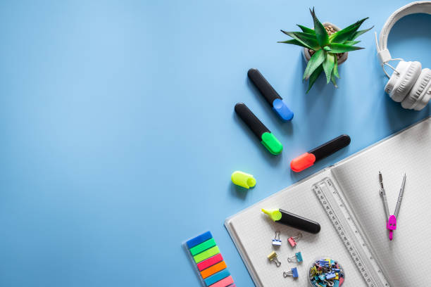istock School supplies stationery on a blue background, copy space. 1406926829