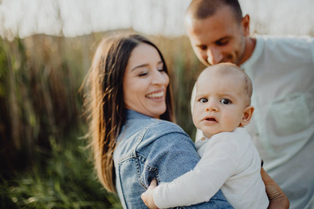 istock Mother, father and baby outside 1406927416