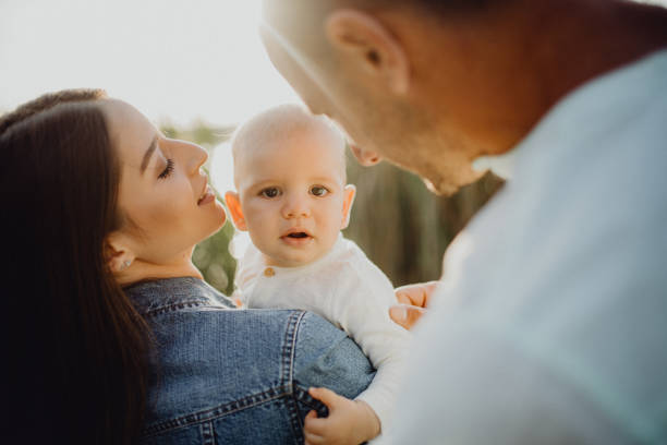istock The baby boy is looking at the camera outside 1406927427