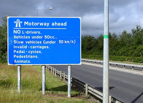 A crossroad in France with directional signs.