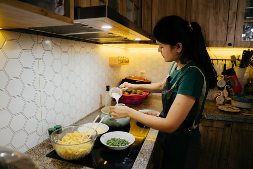 Asian Woman preparing food