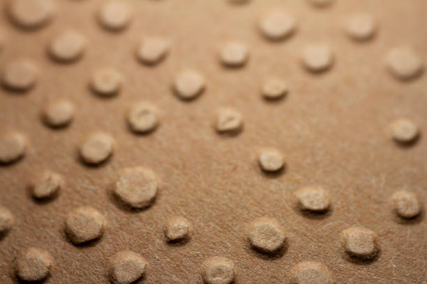 istock Extreme macro of embossed brown paper 1406929226