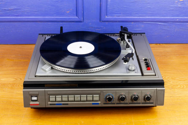 istock Vintage turntable vinyl record player with black vinyl 1406929323