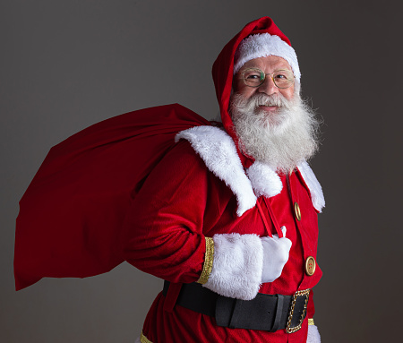 Santa Claus on gray background with copy space.