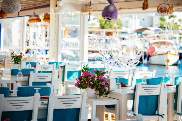 istock Dining Table Decorated With Flowers by the Sea 1406934123