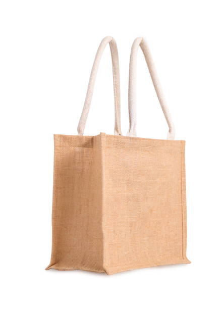 istock Fabric Hessian bag, sack brown with handle, reusable shopping bag isolated on white background. 1406934151
