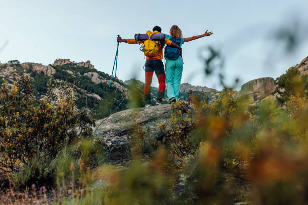 istock Hikers celebrating reaching mountain summit 1406934194