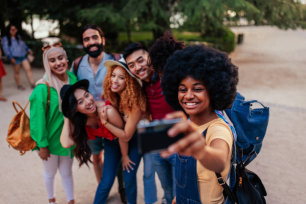 istock Group of tourists taking selfie abroad 1406934625