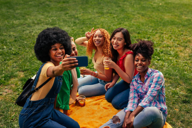 istock Girls take selfie on picnic 1406934695