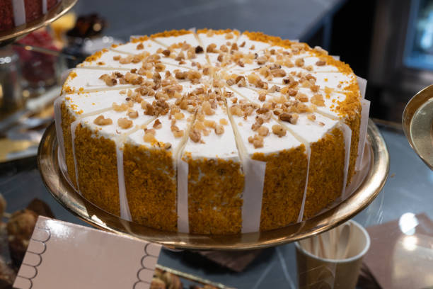 istock Cake Covered with Cream and Crushed Walnuts Cut into Single Serving Portions 1406935487