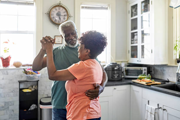 istock Retired Black seniors dancing in kitchen 1406942081