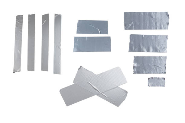 istock Silver scotch tape pieces isolated on white background. 1406943191