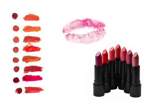 Lipstick swatches isolated on white background. Top view.