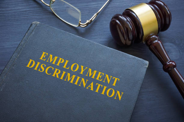 Law about employment discrimination and gavel on the table. Law about employment discrimination and a gavel on the table. prejudice stock pictures, royalty-free photos & images