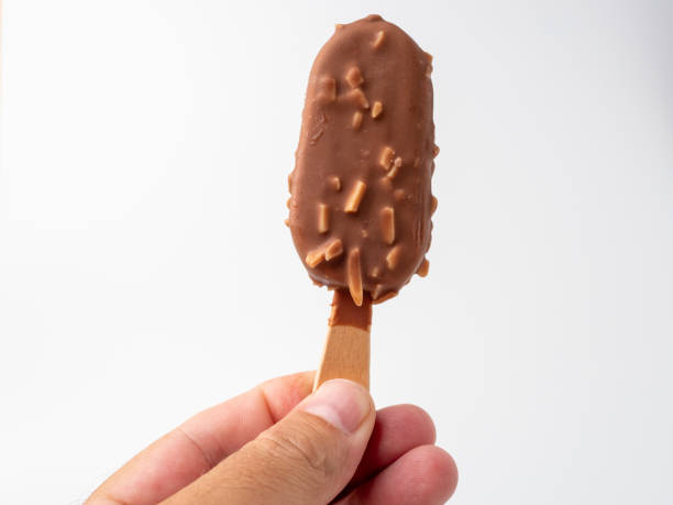 istock Chocolate Ice Cream with almonds on a stick. Ice cream on a white background. 1406944484