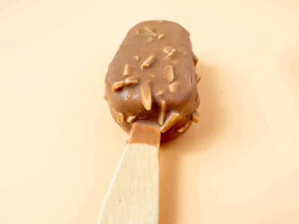 istock Chocolate Ice Cream with almonds on a stick. 1406944503