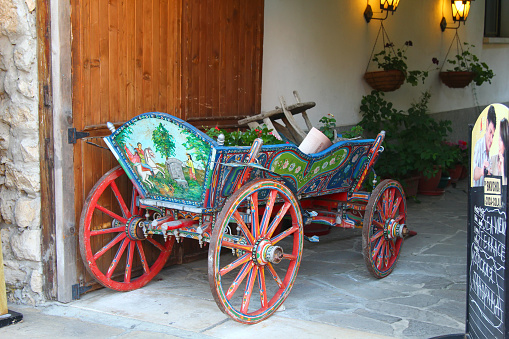 Nessebar, Bulgaria - 14 July 2013: Old painted cart, folk handicraft.