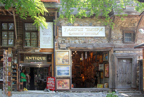 Sozopol, Bulgaria - Jule 16, 2013: An old cobblestone street lined with souvenir shops in resort town.