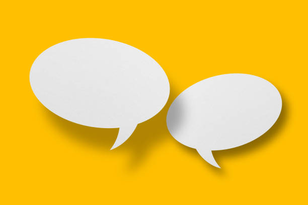 istock White paper in speech bubble shape set against yellow background. 1406945360