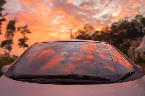 istock Colorful Sunset reflection on the car windshield 1406947142